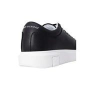Back view of Armani Exchange black leather low-top sneakers for men with white rubber sole and branding on heel