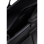 Black leather Armani Exchange handbag interior with zip pocket and brand label in polyurethane material