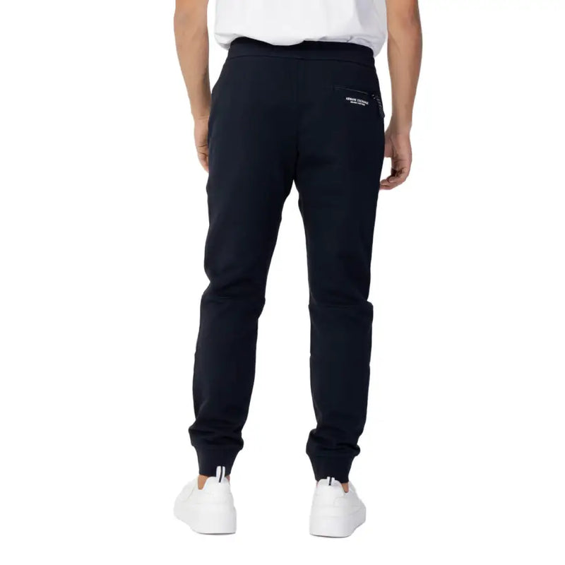 Back side of black armani exchange cotton jogger pants with subtle logo patch on the back pocket for fall winter