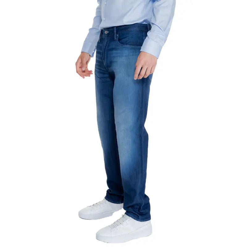 Blue denim jeans with white stitching and a slim fit design.