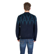 Navy blue sweater with teal zigzag pattern and crew neck.