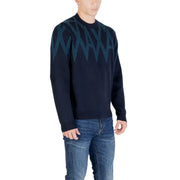 Navy blue sweater with green zigzag pattern, likely made of wool or cotton blend.