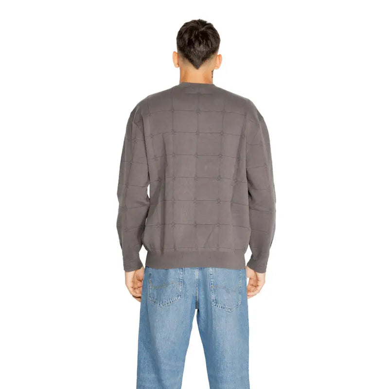 Charcoal gray quilted sweater with a checkered pattern and ribbed cuffs, collar, and hem.
