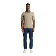 Armani Exchange Polo beige côtelé en coton pour homme, avec un col zippé à mi-hauteur, idéal pour une tenue décontractée.