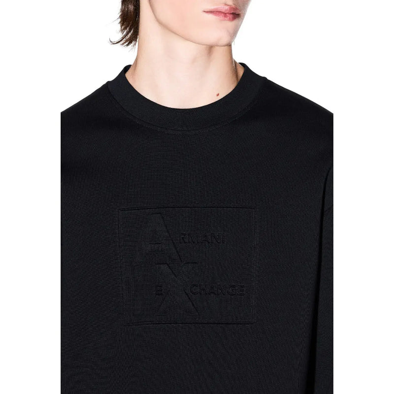 Armani Exchange Sweat-shirt noir en coton pour homme, col rond, avec un logo discret en relief sur la poitrine.