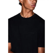 Armani Exchange T-shirt noir en coton pour homme, manches courtes, avec logo brodé discret sur la poitrine.
