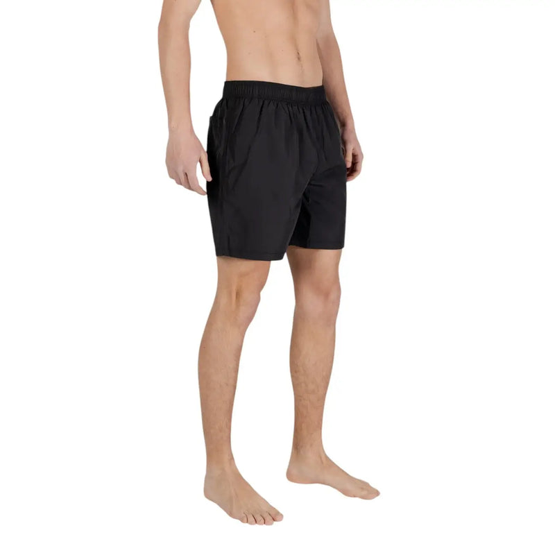 Black athletic swim trunks with elastic waistband made of polyester for men by Armani Exchange spring summer collection