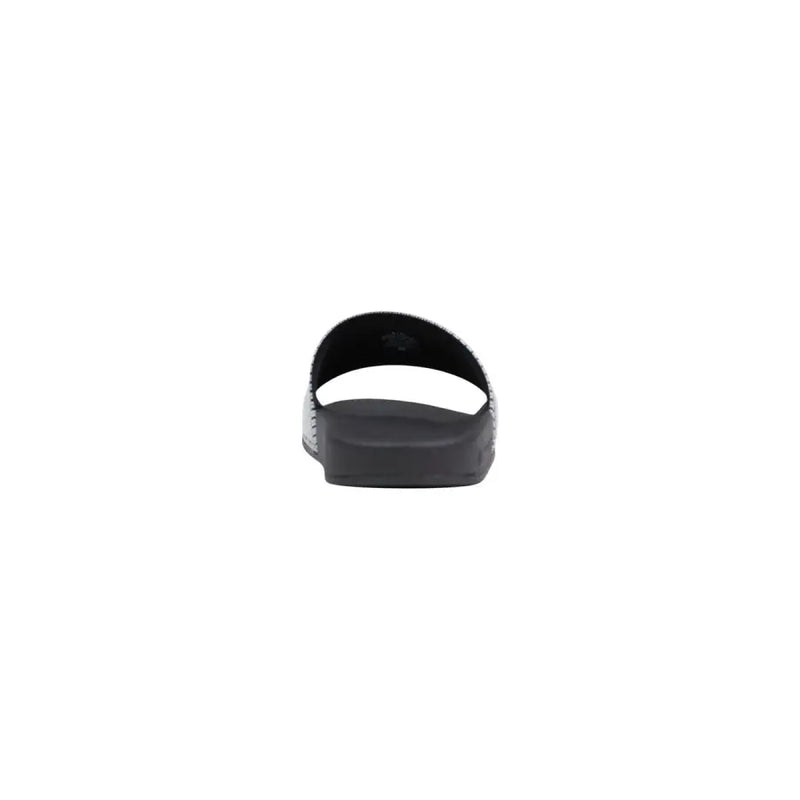 Armani Exchange Sandales noires pour homme avec bride en PVC texturé et semelle en caoutchouc, idéales pour une tenue décontractée.