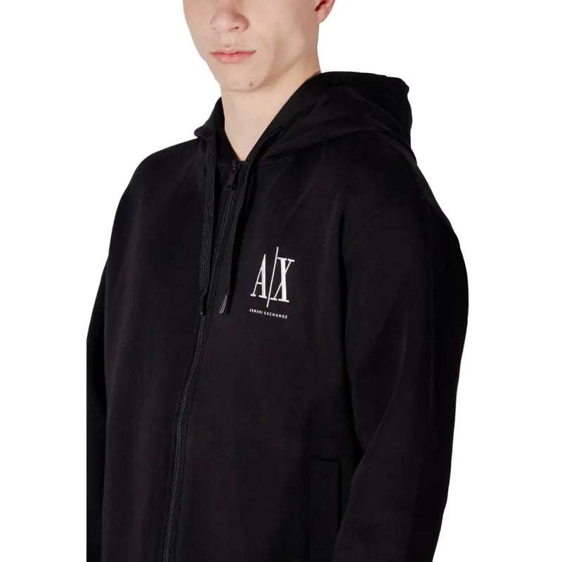 Armani Exchange Sweat-shirt à capuche zippé noir pour homme en coton, orné d'un logo en forme de X barré blanc et d'un texte « change » imprimé sur la poitrine.
