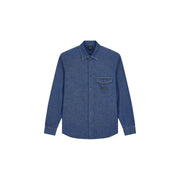 Armani Exchange Chemise classique en denim bleu pour homme, en coton texturé, avec empiècement en cuir sur la poche poitrine.