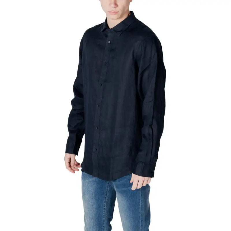 Men’s dark blue long-sleeved button-up linen shirt with button-down collar and blue jeans