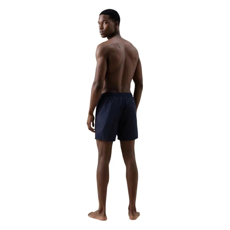 Armani Exchange Short de bain homme en polyester imprimé bleu marine, au design élégant et à taille élastique.