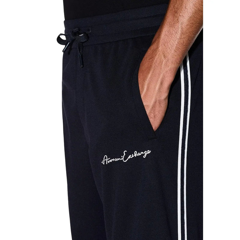 Armani Exchange Pantalon de survêtement noir pour homme en mélange de polyester avec bandes latérales blanches et logo American Exchange brodé sur la cuisse
