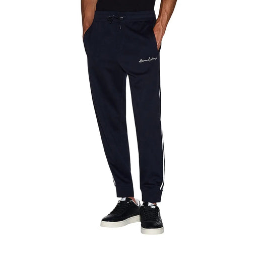 Armani Exchange Pantalon de jogging bleu marine pour homme, mélange de polyester et de coton, avec bandes latérales blanches et logo brodé sur la cuisse.
