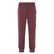 Armani Exchange Pantalon homme en coton bordeaux, doublé polaire bordeaux, avec taille élastiquée à cordon et ourlets rayés.