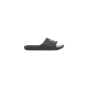 Sandales Calvin Klein noires à enfiler, au design minimaliste et au logo blanc discret sur la bride, pour hommes, style mules en caoutchouc