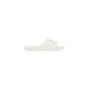 Sandales blanches à enfiler, au design minimaliste et ornées d'un discret logo bleu sur la bride. armani exchange pantoufles en caoutchouc pour hommes
