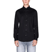 Armani Exchange Chemise noire à manches longues pour homme, boutonnée, avec un léger brillant et des boutons argentés, en tissu raffiné.