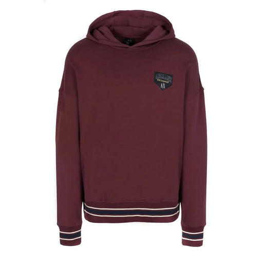 Armani Exchange Sweat-shirt homme bordeaux à capuche avec poche, poignets rayés noirs et blancs et écusson logo.