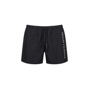 Armani Exchange men swimwear black swim trunks with white vertical branding on the side for beach and pool use