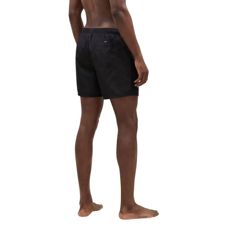 Armani Exchange men swimwear black swim trunks with a subtle logo on the waistband in a sleek design