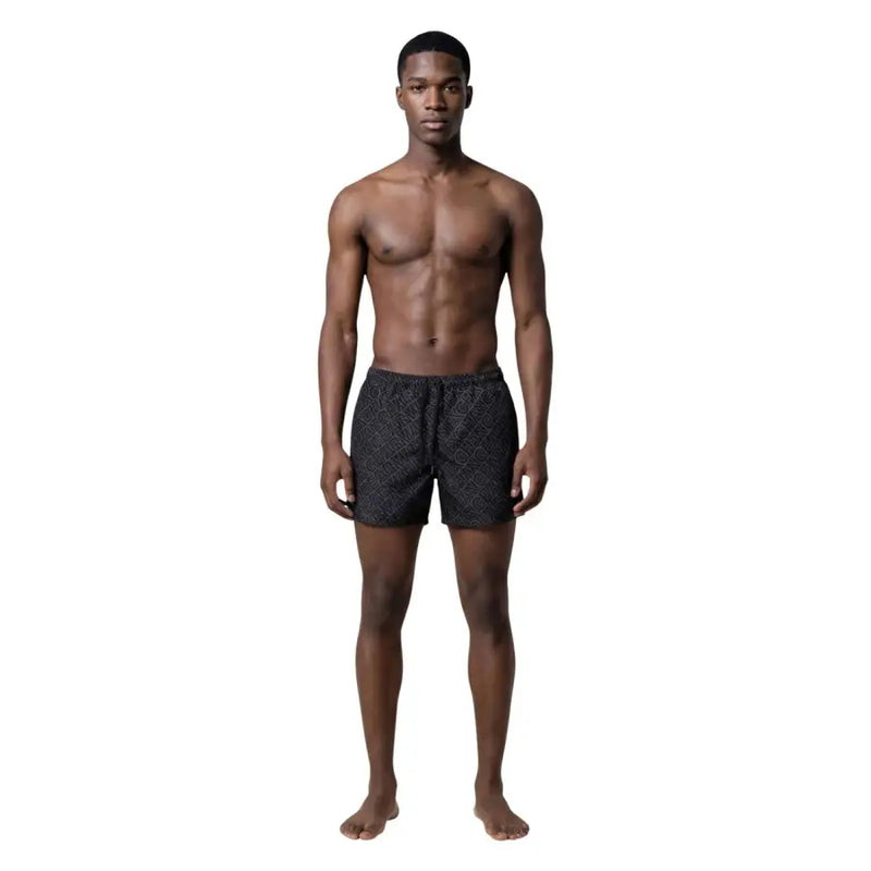 Armani Exchange men swimwear black swim trunks with a subtle geometric pattern for stylish beachwear