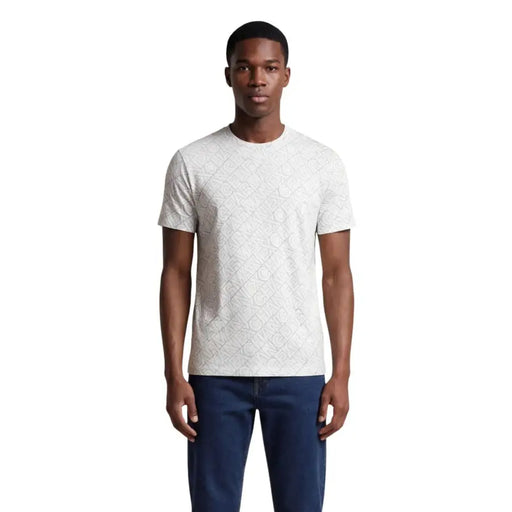 Armani Exchange hommes blancs t-shirt avec un motif discret et répétitif du logo Calvin Klein, en tissu de coton confortable