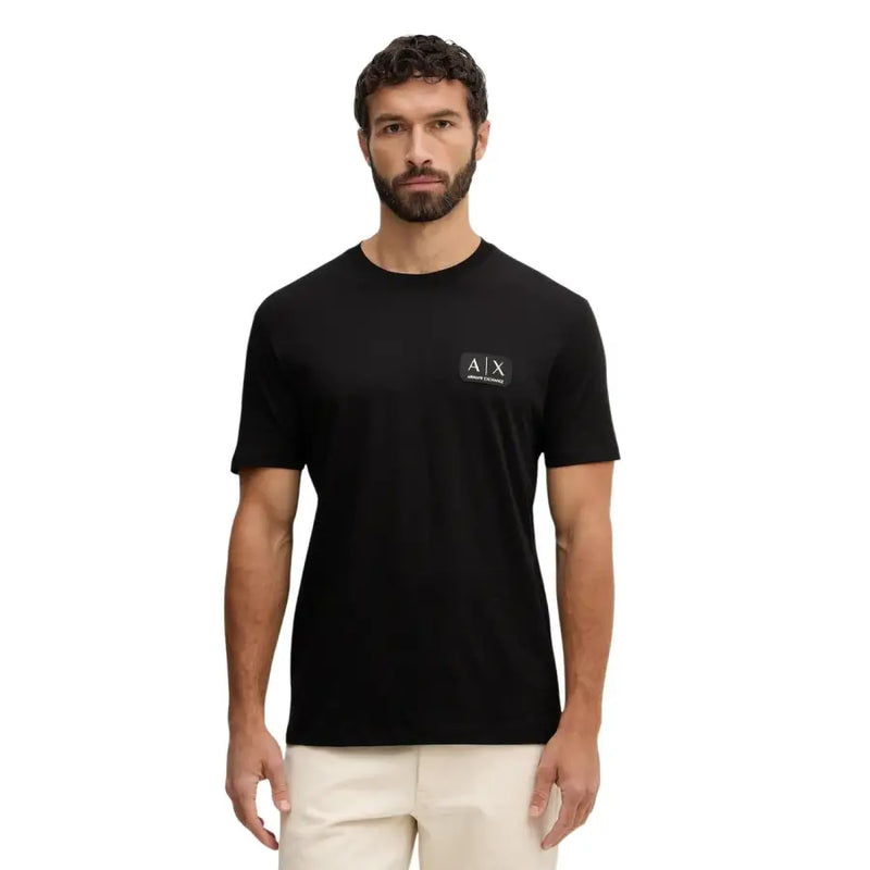 Armani Exchange hommes t-shirt T-shirt noir à manches courtes orné d'un discret logo blanc sur la poitrine gauche