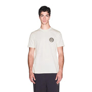 Armani Exchange T-shirt homme en coton blanc crème avec logo circulaire brodé discret sur la poitrine gauche