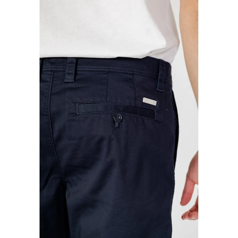 Armani Exchange men’s blue cotton blend shorts back side showing dark navy chino pants texture and branded tag