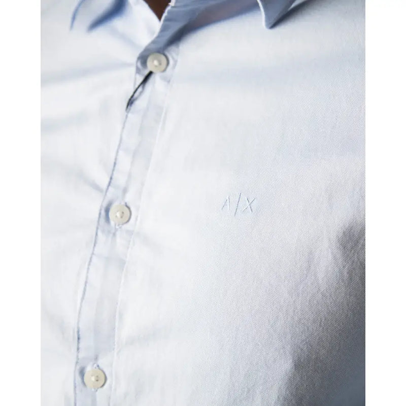 Armani Exchange men’s light blue long classic cotton shirt with subtle embroidered logo on the chest
