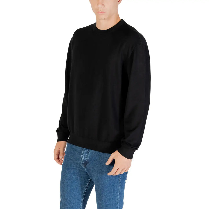 Armani Exchange Pull pour homme noir à col rond, manches longues et poignets côtelés, vue de face