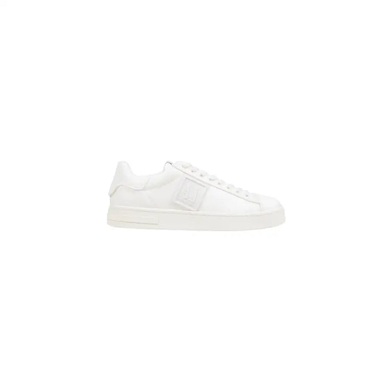 White leather low-top sneaker with lace-up design and chunky sole.