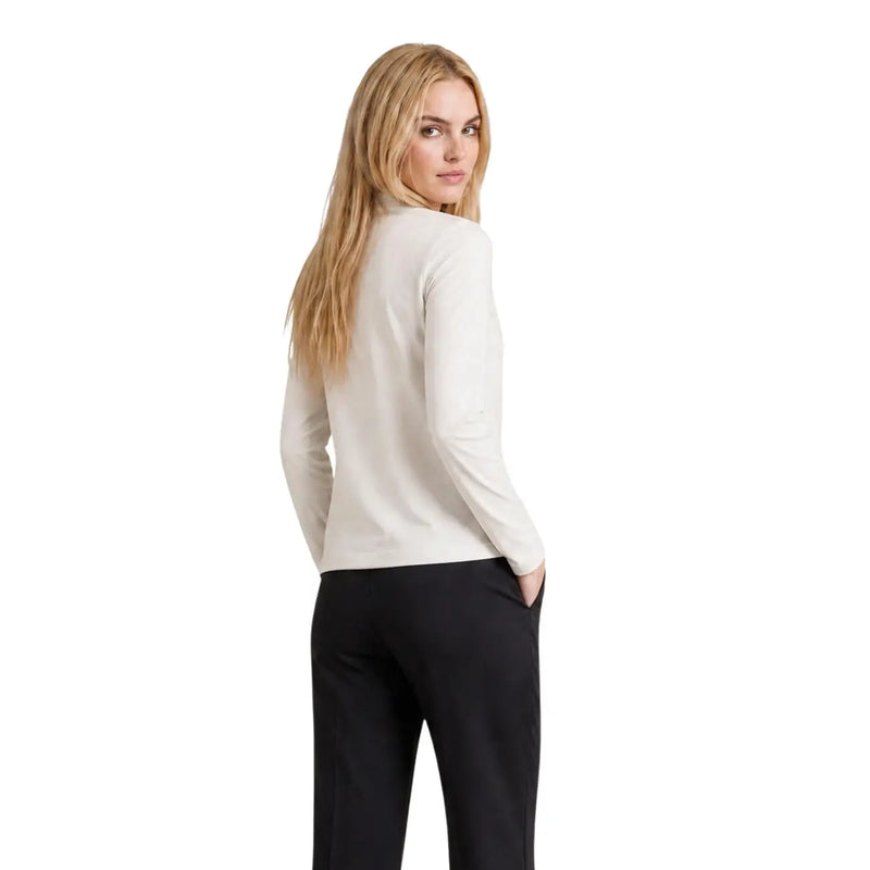 Armani Exchange women beige cotton rhinestone t shirt showing a sleek off-white long-sleeved turtleneck top