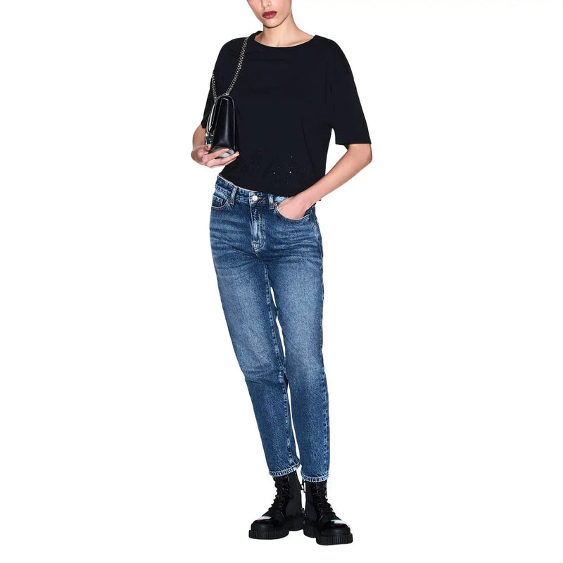 Armani Exchange women black cotton round neck t shirt paired with a black leather chain strap handbag with minimalist design