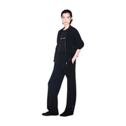 Black oversized bomber jacket with subtle silver embroidery and matching zipper details paired with armani exchange women black cotton round neck t shirt