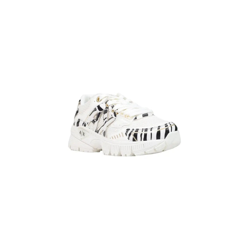 Armani Exchange women black slip on sneakers with white polyester upper featuring bold black zebra stripes and metallic accents