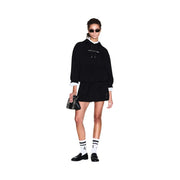 Black and white patterned mini clutch with textured surface paired with armani exchange women black hooded viscose sweatshirt