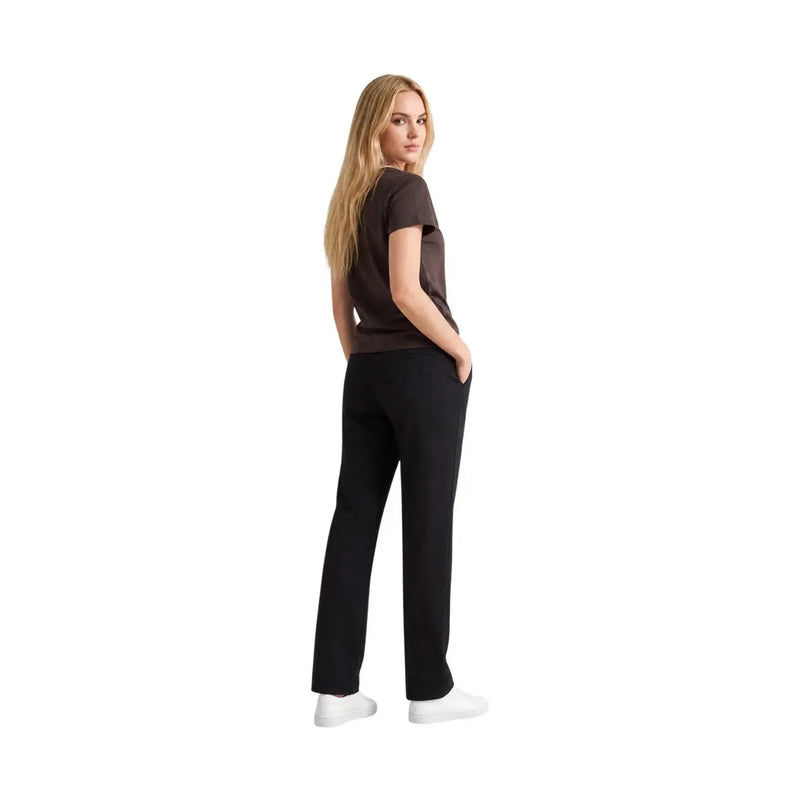Black straight-leg trousers with smooth sleek fabric and subtle side seam detailing paired with armani exchange brown cotton round neck t shirt