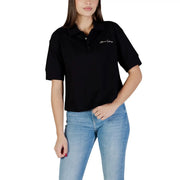Armani Exchange women black short-sleeved cotton polo shirt with subtle white embroidered logo on left chest