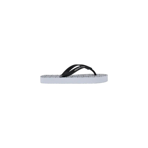 Armani Exchange women white rubber flip flops with black and white straps and a grid-patterned sole