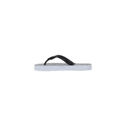 Armani Exchange women white rubber flip-flops featuring black and white grid patterned soles