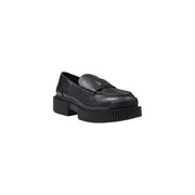 Armani Exchange women’s black leather moccasin slippers with chunky ribbed sole and metallic logo plaque on vamp