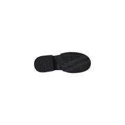 Black rubber sole with textured tread pattern and embossed armani exchange logo on womens leather moccasin slippers