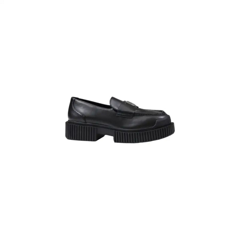 Armani Exchange women’s black leather moccasin slippers with a minimalist design and chunky ribbed sole