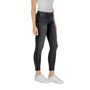 Women’s dark wash skinny jeans with branded side stripe from Armani Exchange for fall winter