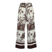 Pantalon Artigli pour femme, beige en viscose à fleurs, jambes larges crème et imprimé tropical marron, idéal pour le printemps-été.