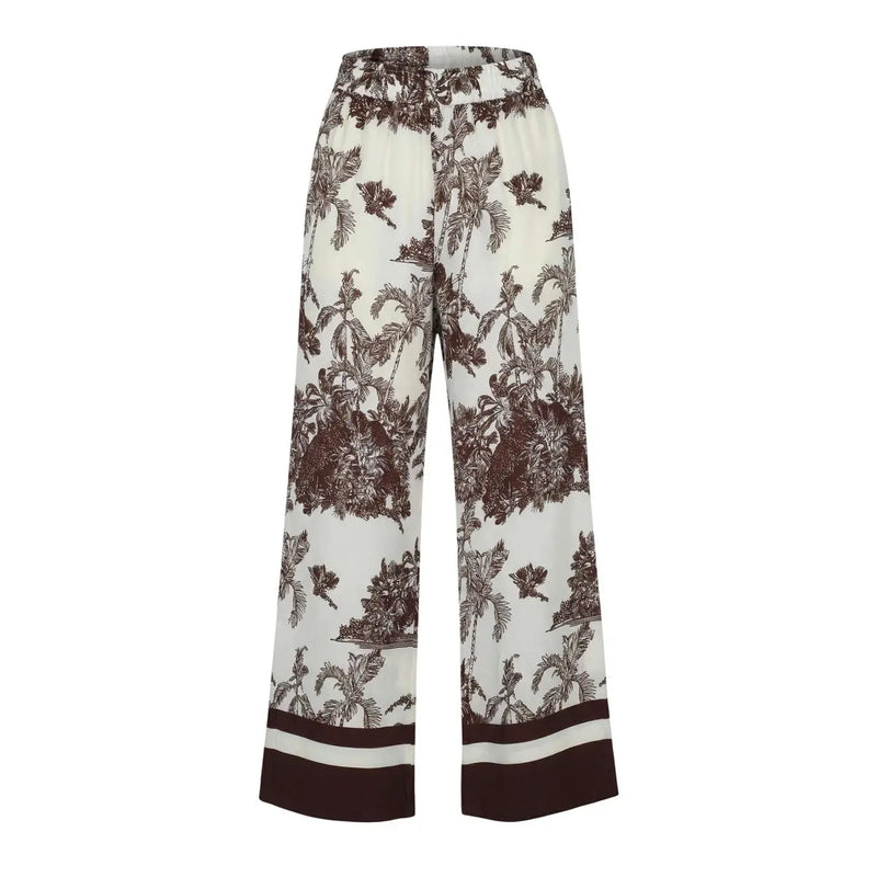 Pantalon Artigli pour femme, beige en viscose à fleurs, jambes larges crème et imprimé tropical marron, idéal pour le printemps-été.