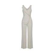 Combinaison Artigli pour femme, beige, sans manches, en polyester, avec un devant asymétrique drapé et un pantalon à jambes larges.