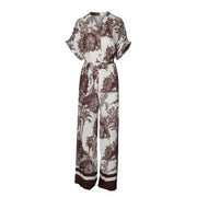 Combinaison Artigli pour femme, beige en viscose à imprimé tropical blanc et marron, manches courtes, fermeture boutonnée sur le devant, pantalon large.